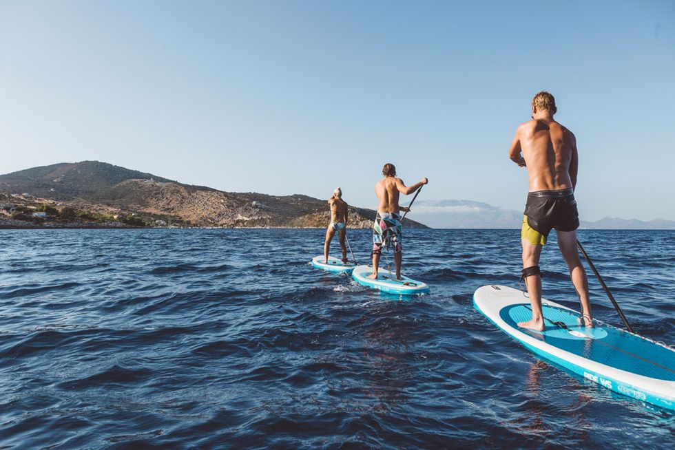 surfers wearing men's swim shorts