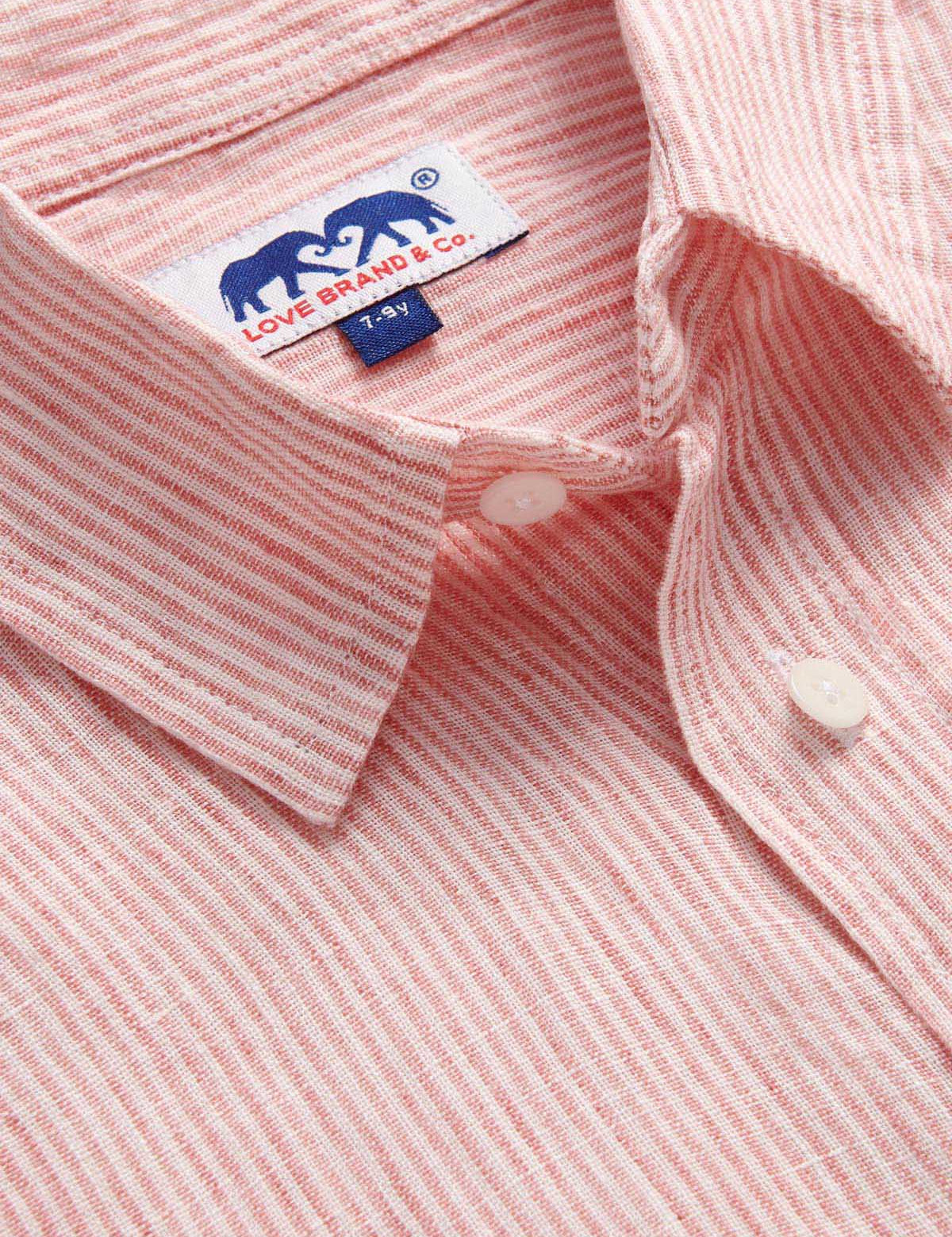 Close-up of Boys Red Lines Abaco Linen Shirt made with 100% linen, featuring a thin red stripes design with white buttons and a collar, perfect for summertime events.