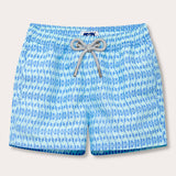 Boys Camel Mirage Sky Staniel Swim Shorts featuring a light blue print with camel silhouettes, drawstring waist, and contrasting white and blue braided drawstring.