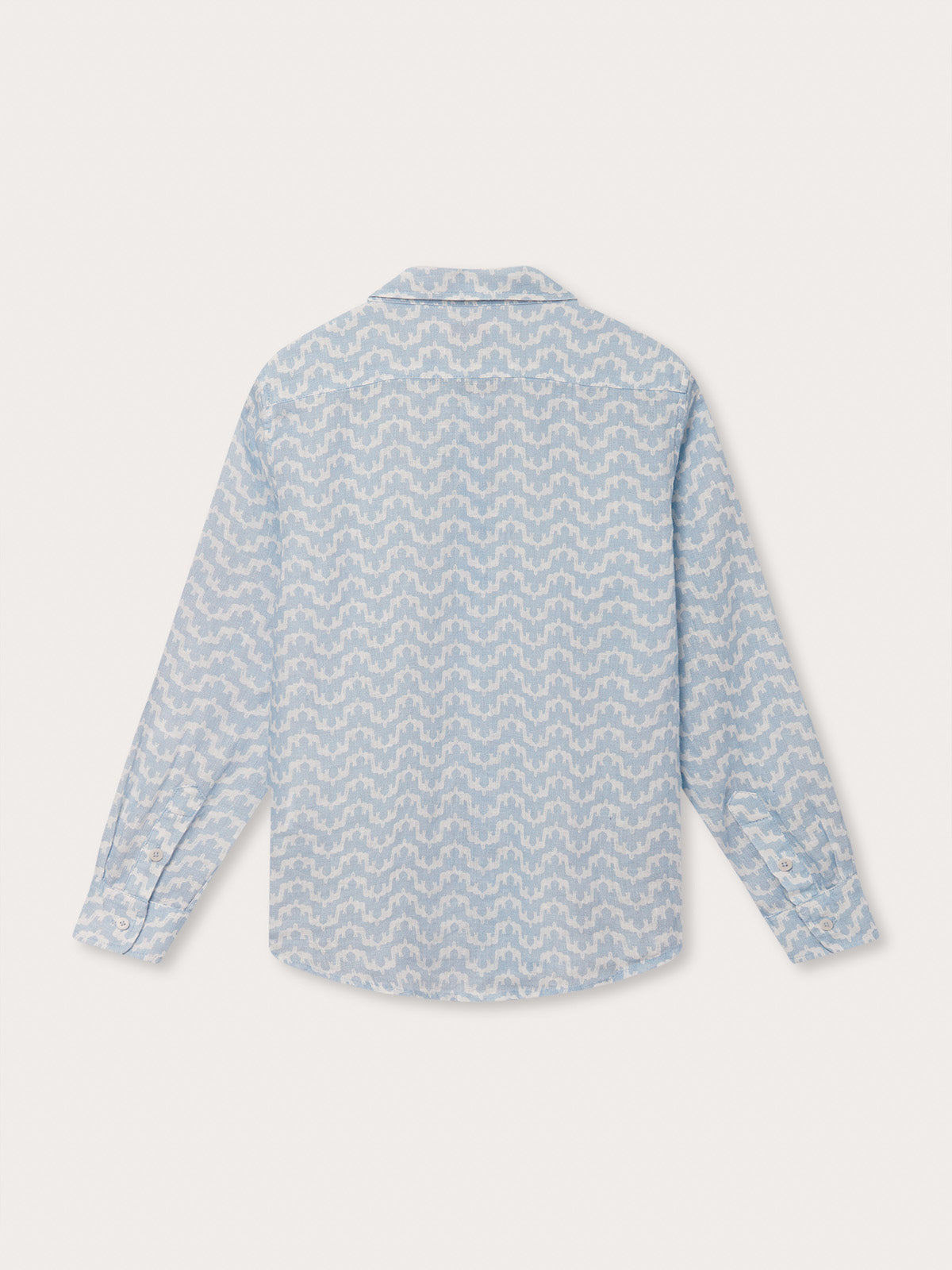 Back view of the Boys Elephant Palace Sky Abaco Linen Shirt in light blue with a print of elephants and Indian palaces, long-sleeved and made from 100% linen.