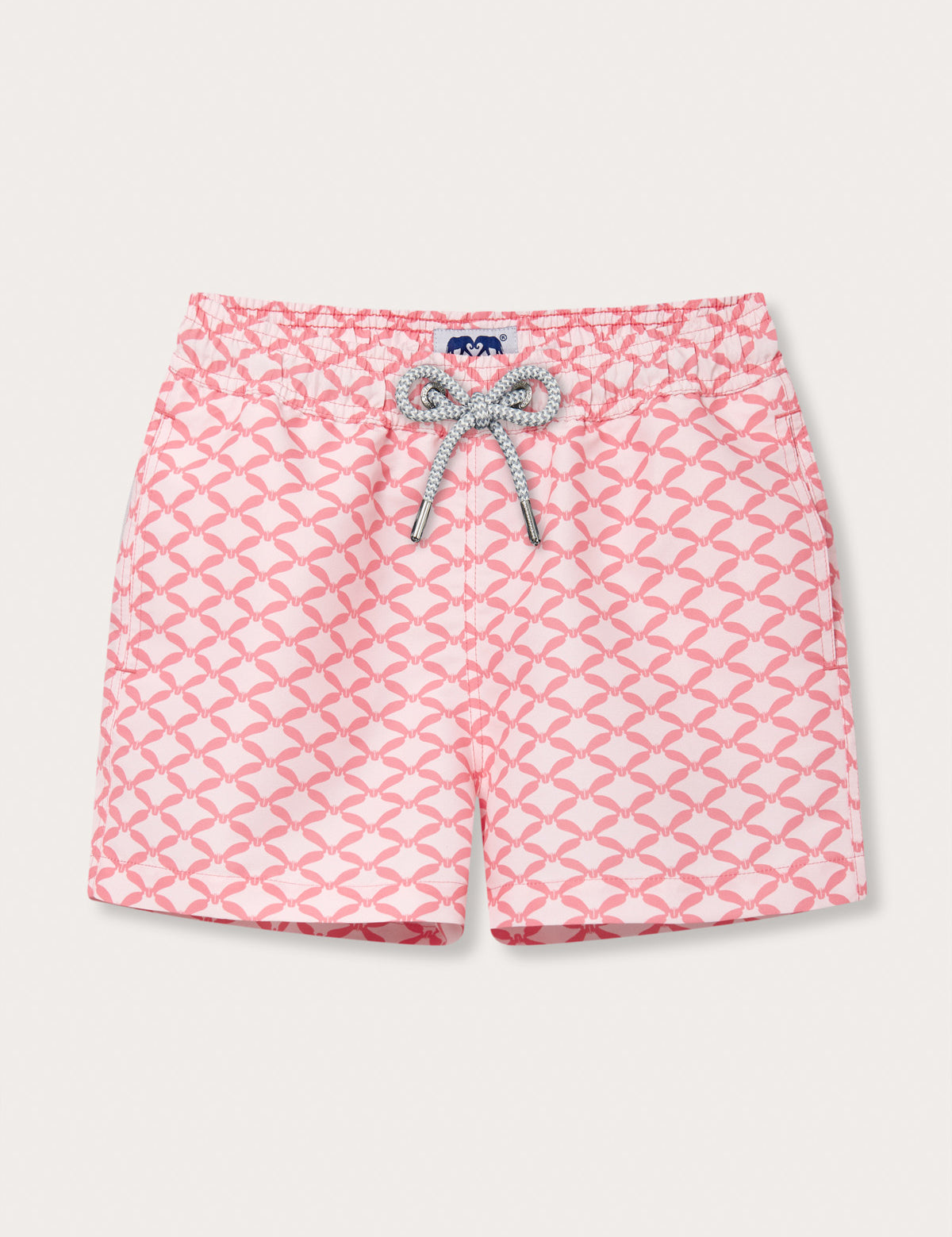 Boys' pink and white geometric print swim shorts with a bow design.