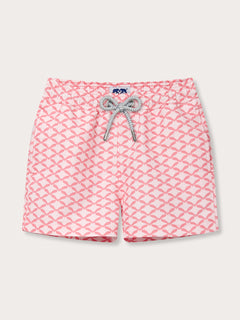 Boys' pink and white geometric print swim shorts with a bow design.