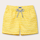 Yellow boys' swim shorts with turtle print and grey drawstring.