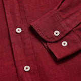 Close-up view of Men's Burgundy Abaco Linen Shirt showcasing button details and sleeve texture.