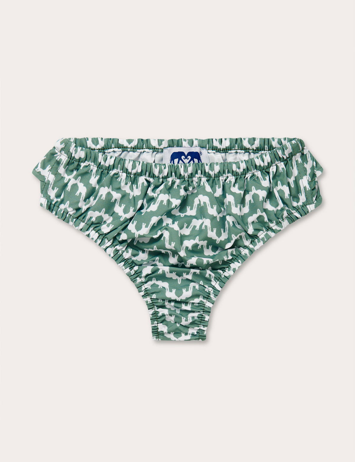 Green patterned baby bottoms featuring an elephant wave pattern resembling Indian palaces.