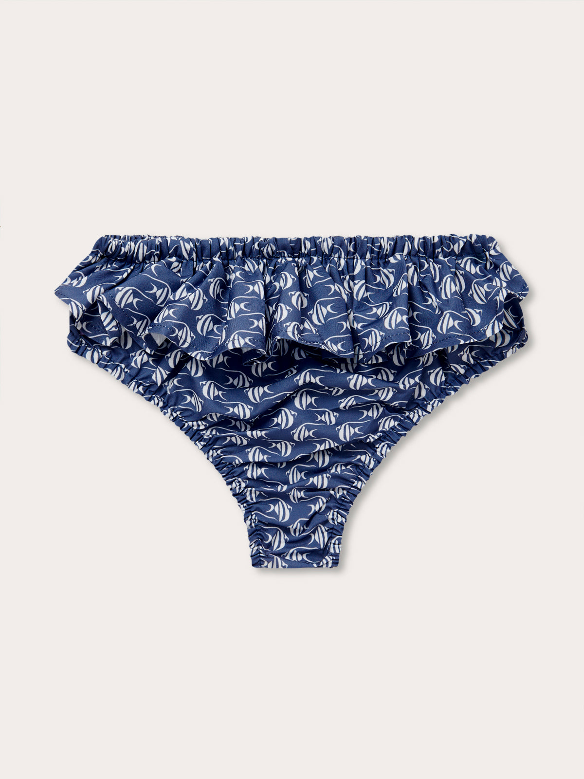 Navy blue baby bottoms with white Moorish Idol fish print and ruffled waist from the Girls Go With the Flow Calabash collection.