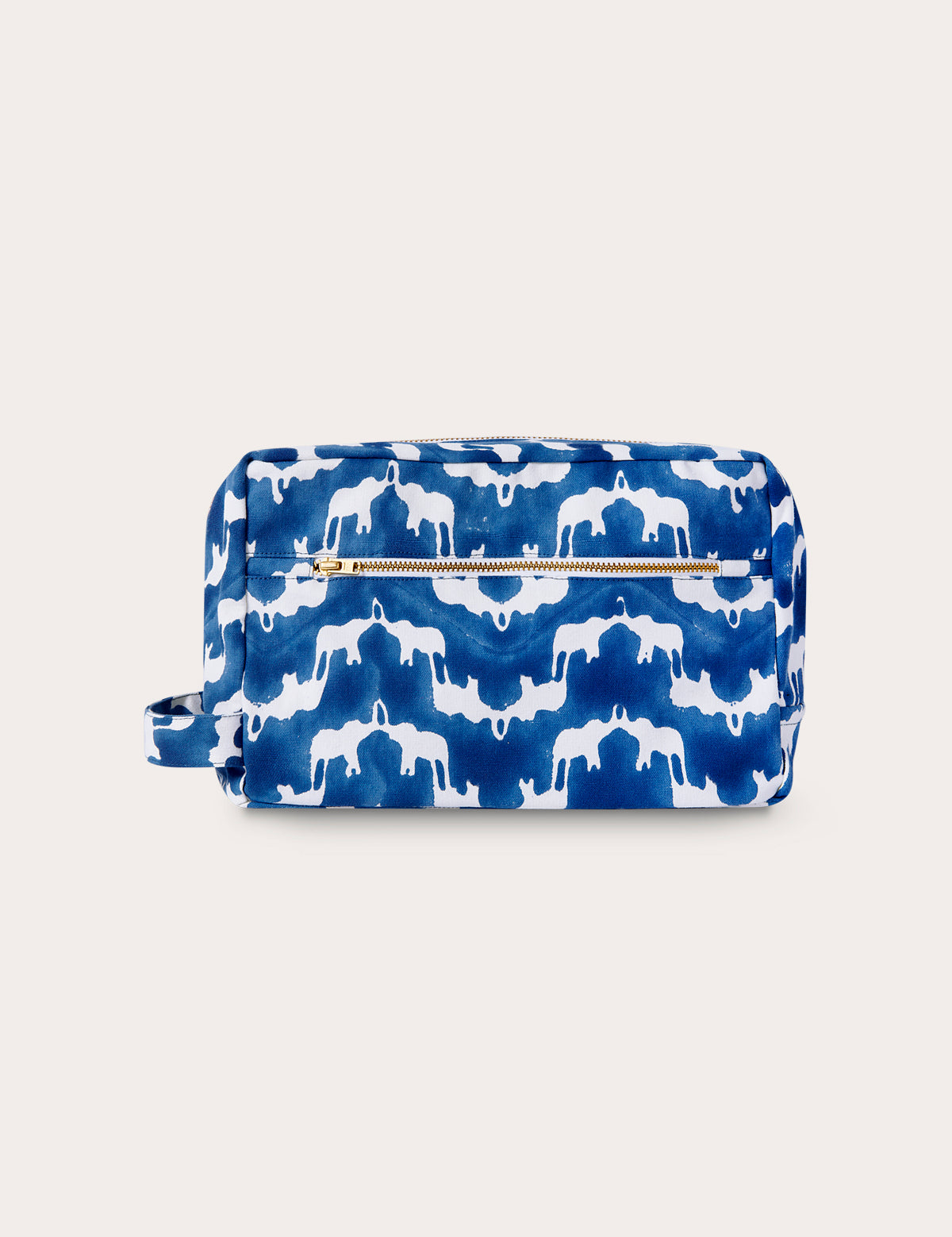 Canvas wash bag featuring "Elephant Palace Blue" print with Asian elephants and an illusion of Indian palaces, crafted from durable block-printed canvas with internal pockets, lined with recycled plastic.