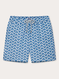 Elephant Palace Blue Staniel mens swim shorts front. Patterned swim shorts featuring white elephants raising their trunks to create a pattern that resembles Indian palaces on a blue background.