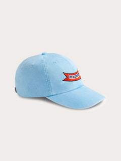 Sky blue cotton peak cap featuring 'The Matriarchy' ribbon embroidery on the front.