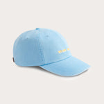 Sky blue cotton peak cap with 'We Are Family' embroidery on the front, featuring a leather strap and brass adjuster.