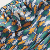 Girls Sea Flowers Calabash Baby Bottoms with vibrant seafloor floral design in yellow ochre, white, and green on a deep blue base, crafted from 100% recycled materials, and featuring quick-drying fabric.