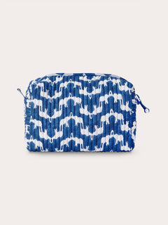 Quilted wash bag in blue with white 'Elephant Palace' print, featuring Asian elephants forming the illusion of Indian palaces, crafted from quilted cotton.