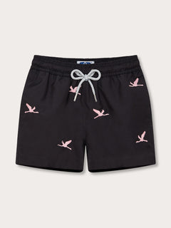 Boys Lake Nakuru Staniel Swim Shorts in black with pink flamingo patterns and drawstring waist.