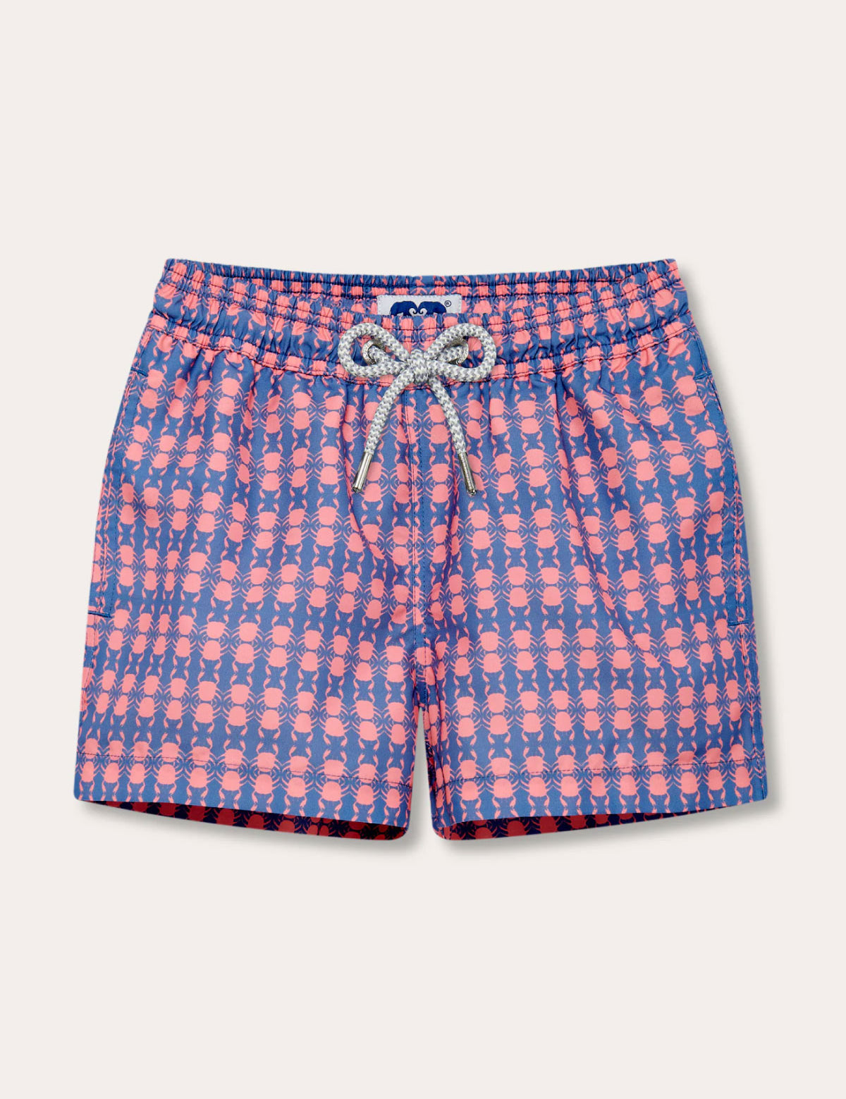 Boys Crab Pool Staniel Swim Shorts featuring a deep blue base with pink crab and watermelon pattern, elastic waistband, and a drawstring tie.