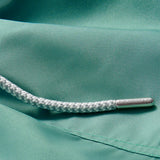 Close-up view of Boys Riviera Green Staniel Swim Shorts detailing quick-dry fabric and drawstring.