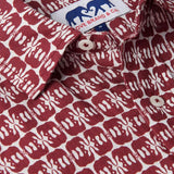 Close-up of Men's Elephants of India Abaco Linen Shirt showcasing dark burgundy elephants pattern on a white background with visible brand label. Old money shirts crafted from 100% linen.