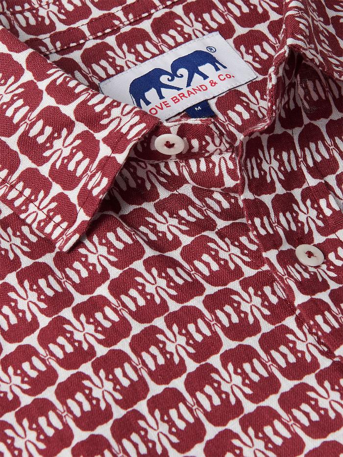 Close-up of Men's Elephants of India Abaco Linen Shirt showcasing dark burgundy elephants pattern on a white background with visible brand label. Old money shirts crafted from 100% linen.