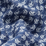 Close-up view of deep blue linen fabric with unique white Moorish Idol fish print for Men's Go With the Flow Joulter Linen Shorts.