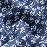 Close-up view of deep blue linen fabric with unique white Moorish Idol fish print for Men's Go With the Flow Joulter Linen Shorts.