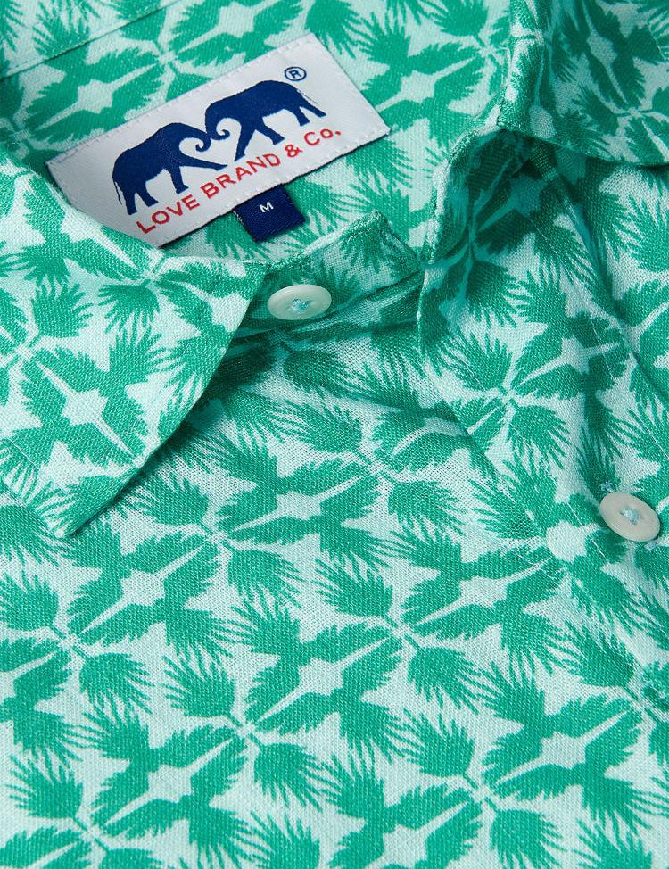 Close-up of Men's Palm Eagle Abaco Linen Shirt showcasing tropical palm leaves and eagle design with brand label. Old money shirts made from 100% linen.