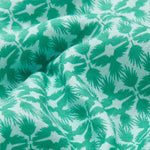 Close-up view of the green and white tropical palm and eagle pattern on the Men's Palm Eagle Joulter Linen Shorts.