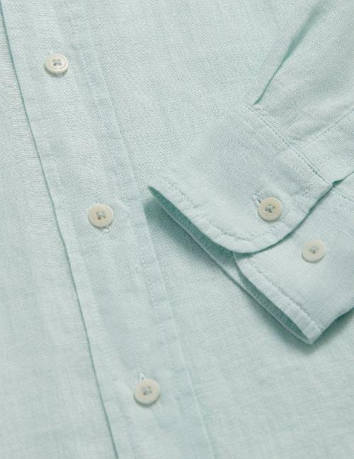 Close-up of Sea Air Abaco men's Linen Shirt in pastel hue showing buttons and sleeve details.