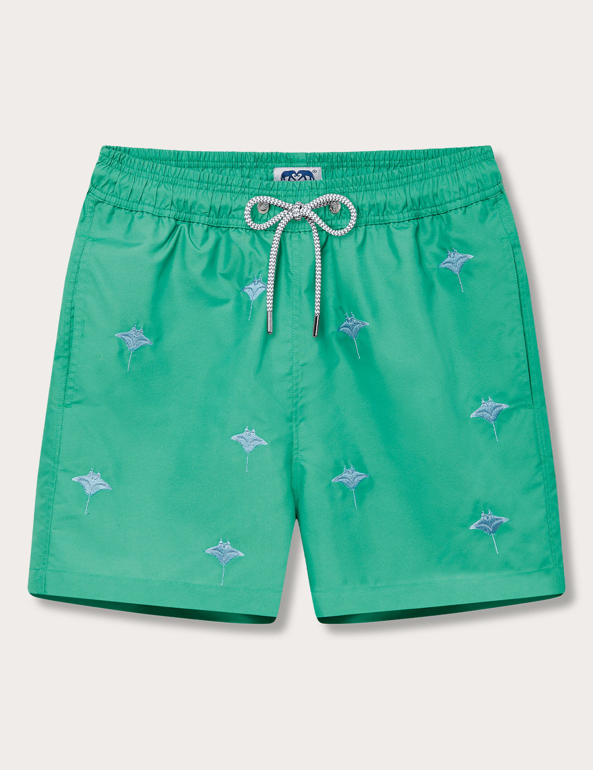 Green men's swim shorts with embroidered manta rays.