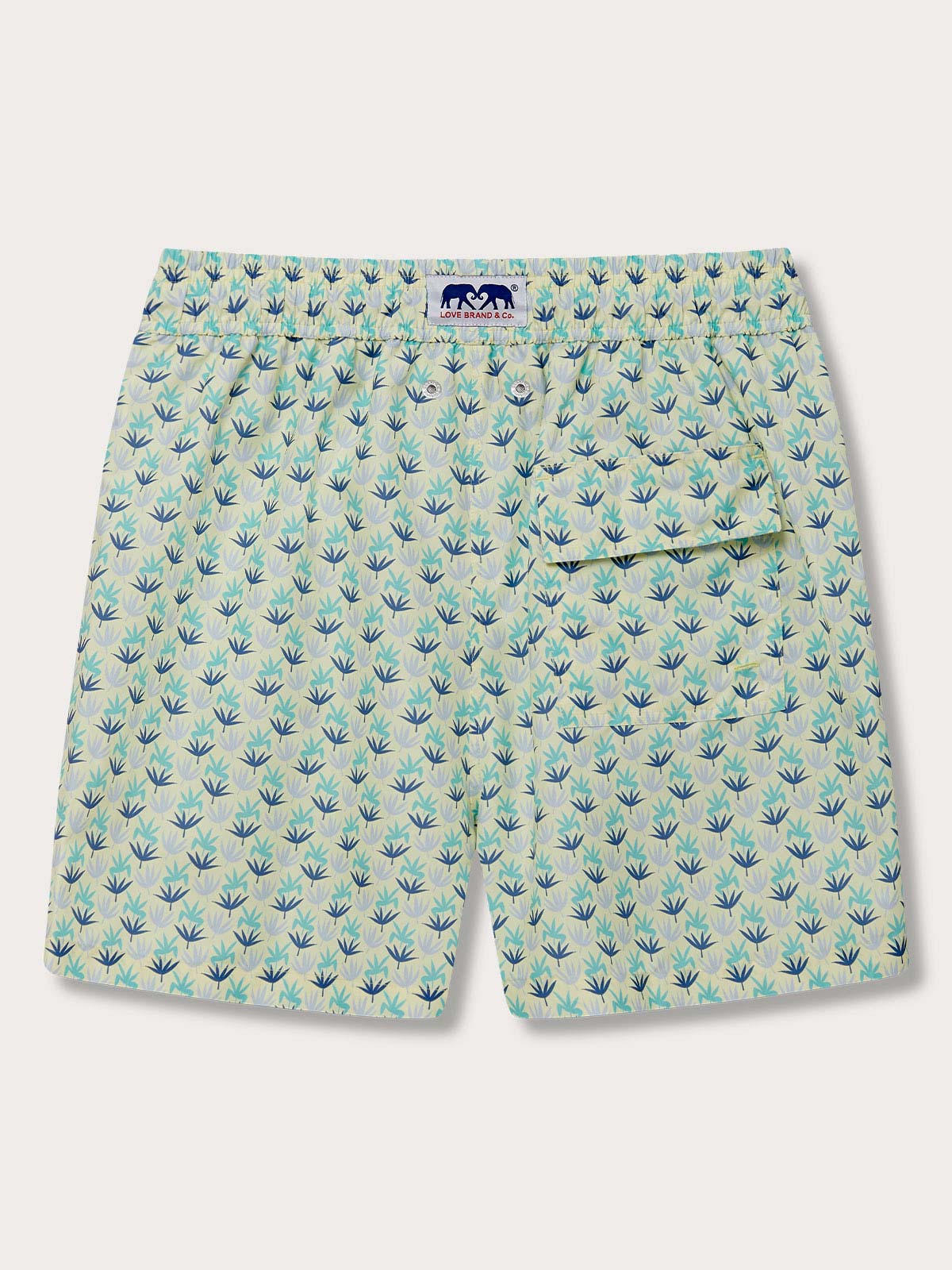 Men's Palm Sugar Staniel Swim Shorts with fan palm design in pale yellow and blue accents. Patterned swim shorts crafted from 100% recycled quick-dry materials.