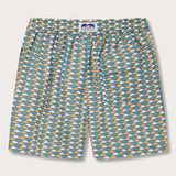 Men's Sea Flowers Staniel Swim Shorts with a vivid pattern of ochre, white, and green sea anemones. Patterned swim shorts on a deep blue background, made from 100% recycled materials.