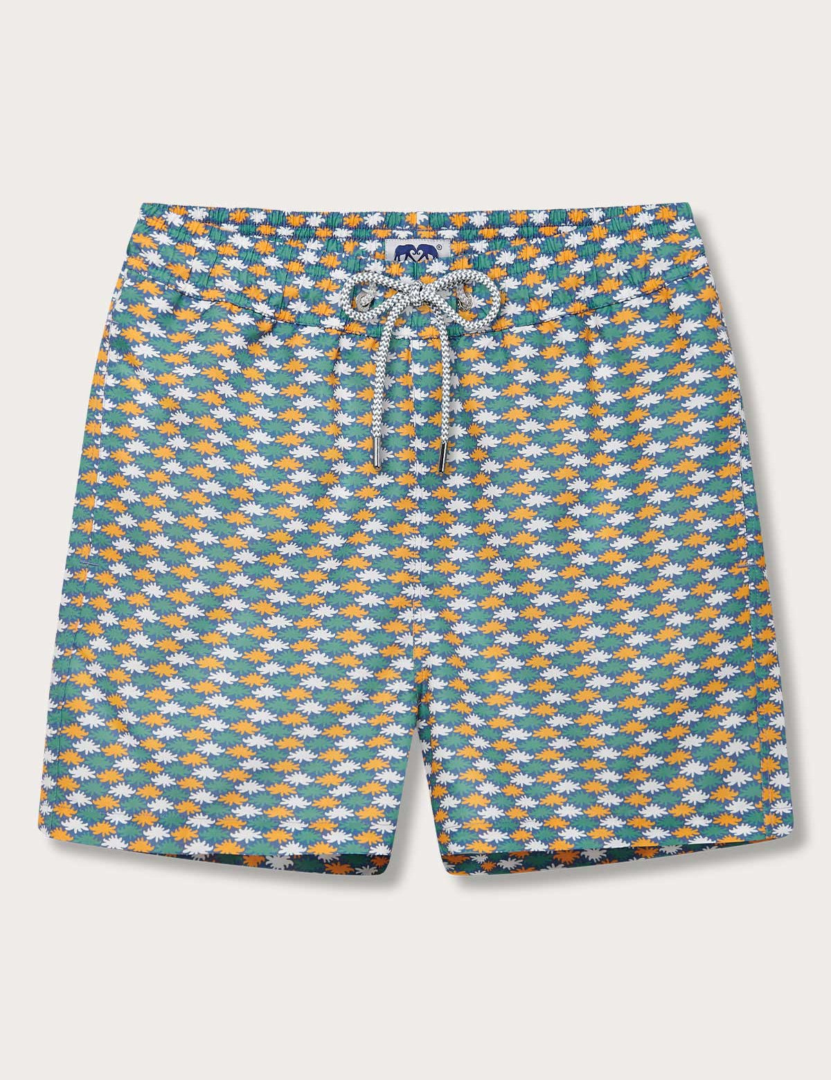 Men's Sea Flowers Staniel Swim Shorts with ochre, white, and green sea anemone pattern on a deep blue background.