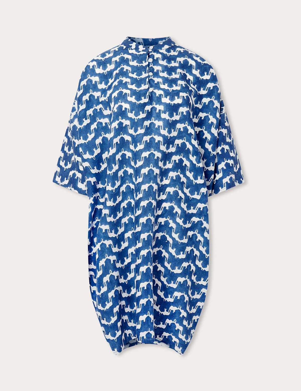 Linen Poncho in Elephant Palace Blue pattern, showcasing a blue and white print with Asian elephants crafted from 100% premium Belgian linen.