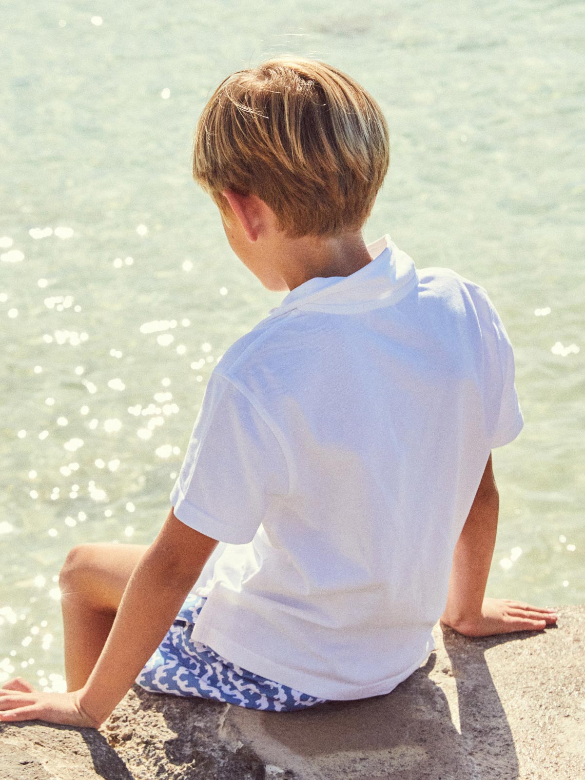 collection of kids patterned shirts